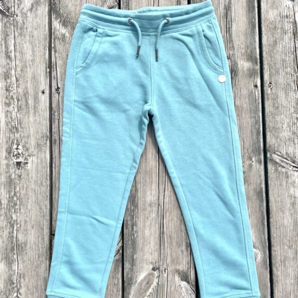 Un jogging turquoise pour fille de la marque régionale 33.